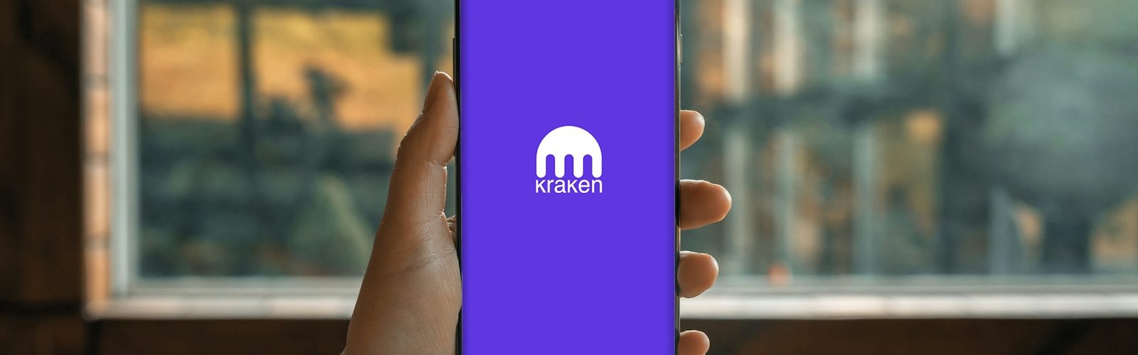 a hand holding a cell phone