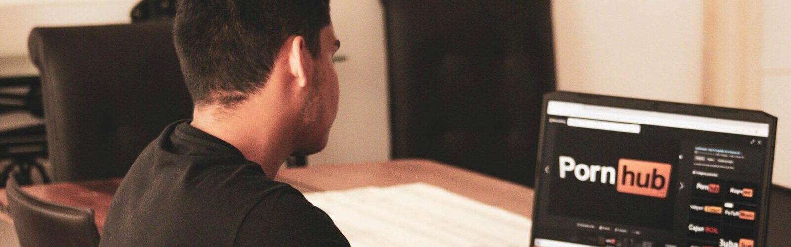 man in black t-shirt using black laptop computer