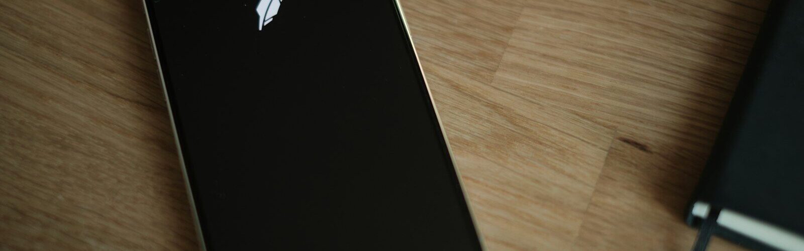 A close up of a cell phone on a table