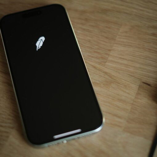 A close up of a cell phone on a table