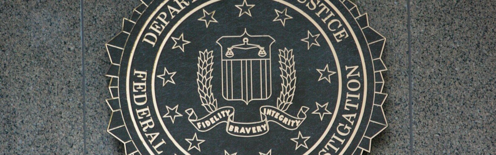 the seal of the department of justice on a wall