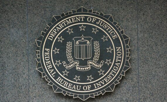 the seal of the department of justice on a wall