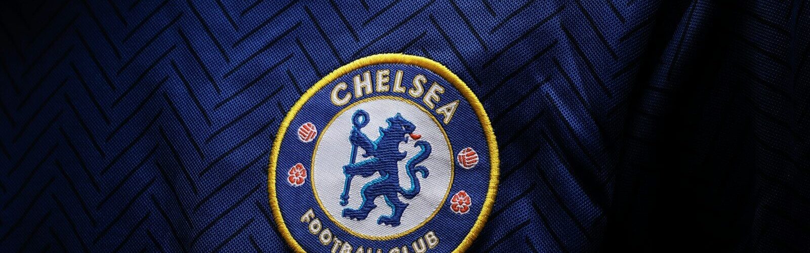 a close up of the chelsea badge on a shirt